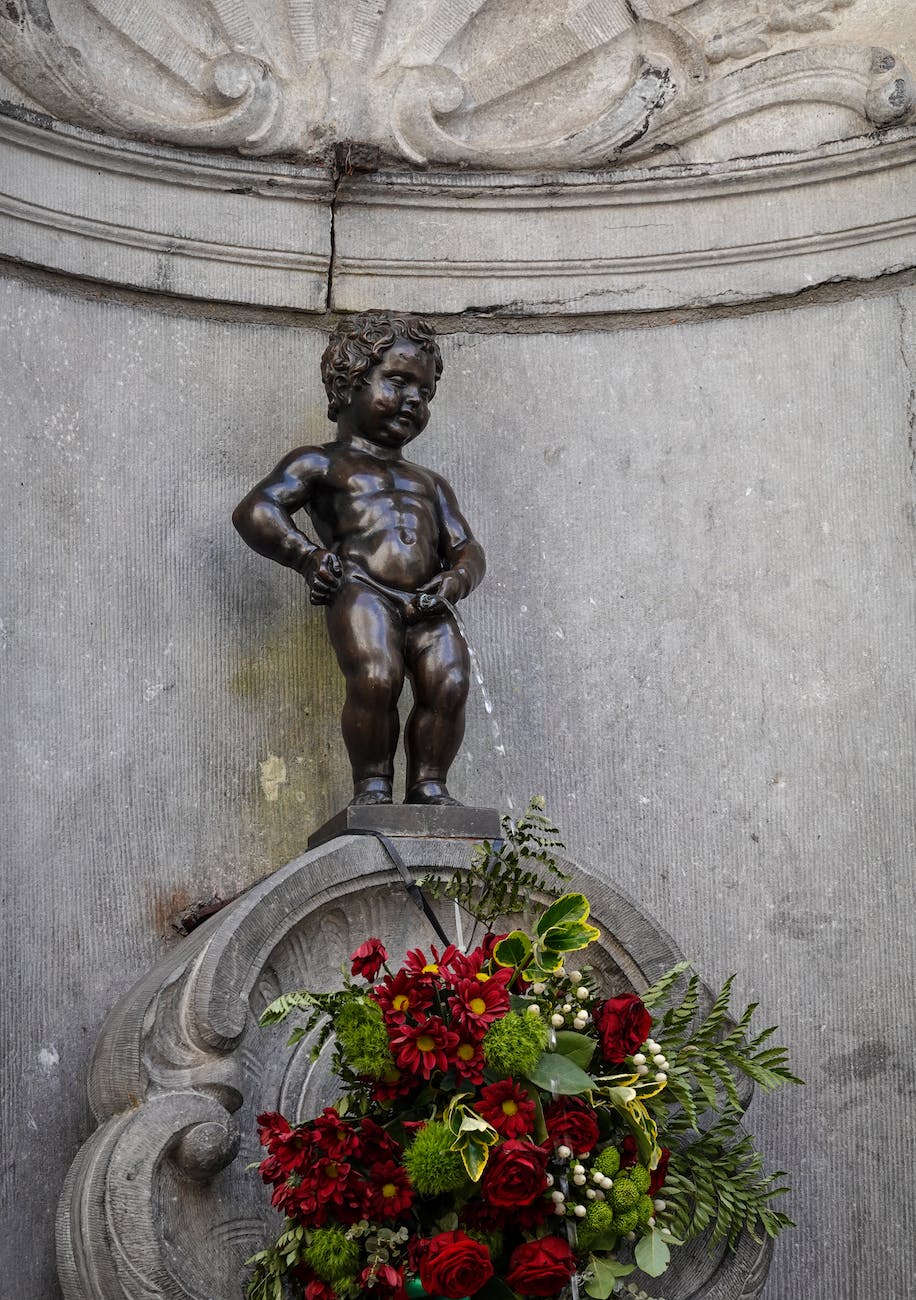 concrete statue near flowers